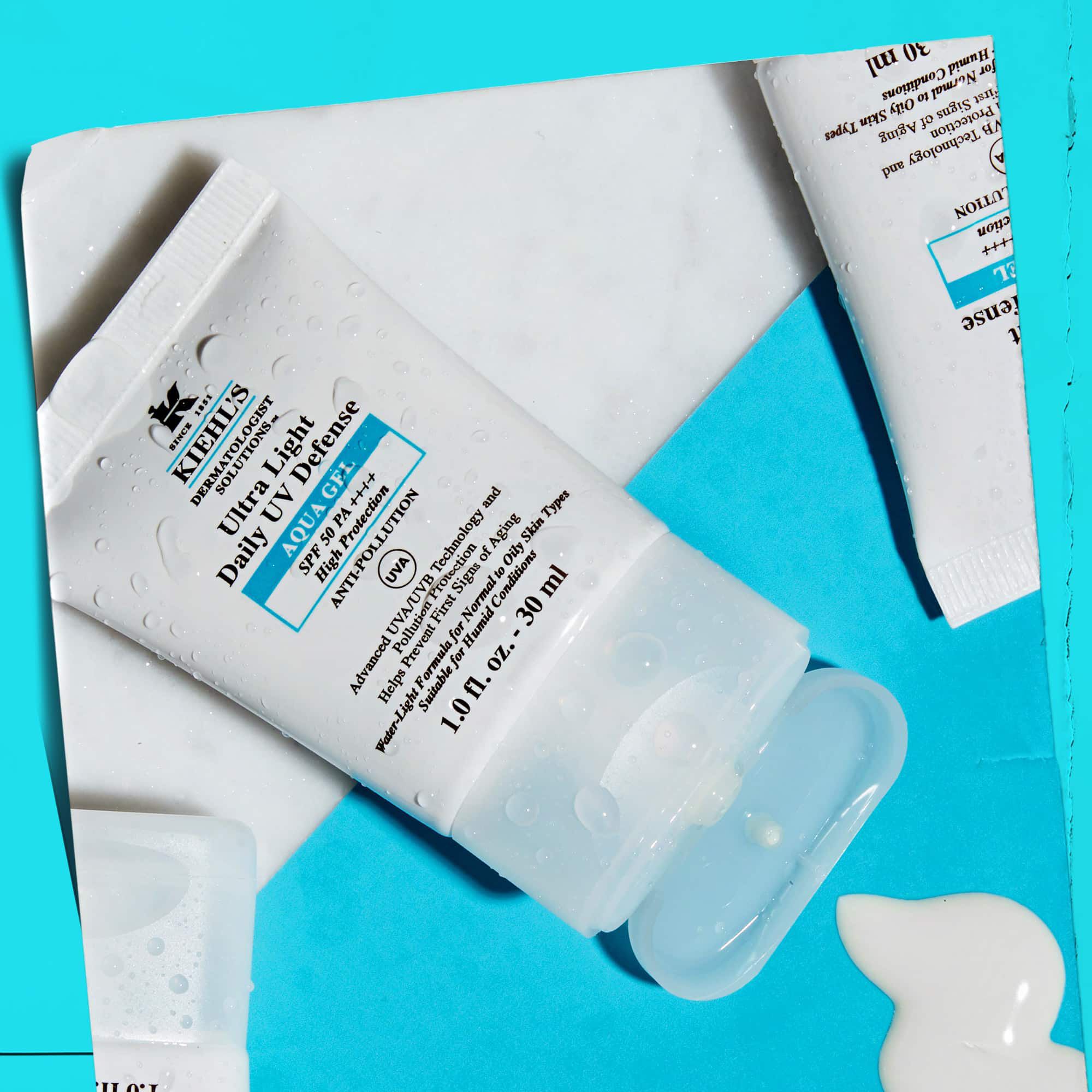 Tobb Ultra Light Daily UV Defense Aqua Gel tubus elrendezese marvanyfeluleten, bemutatva eletstilusbeli vonzerejuket.