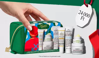 Hydrating Holiday Hits" skincare gift set on a green background, featuring Ultra Facial Cream and Creamy Eye Treatment with Avocado in festive packaging.