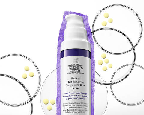 Kiehl's retinol bőrkiegyenlitő nappali szerum, lila csomagolasban, feher hatterrel es kerek formakkal korulveve.